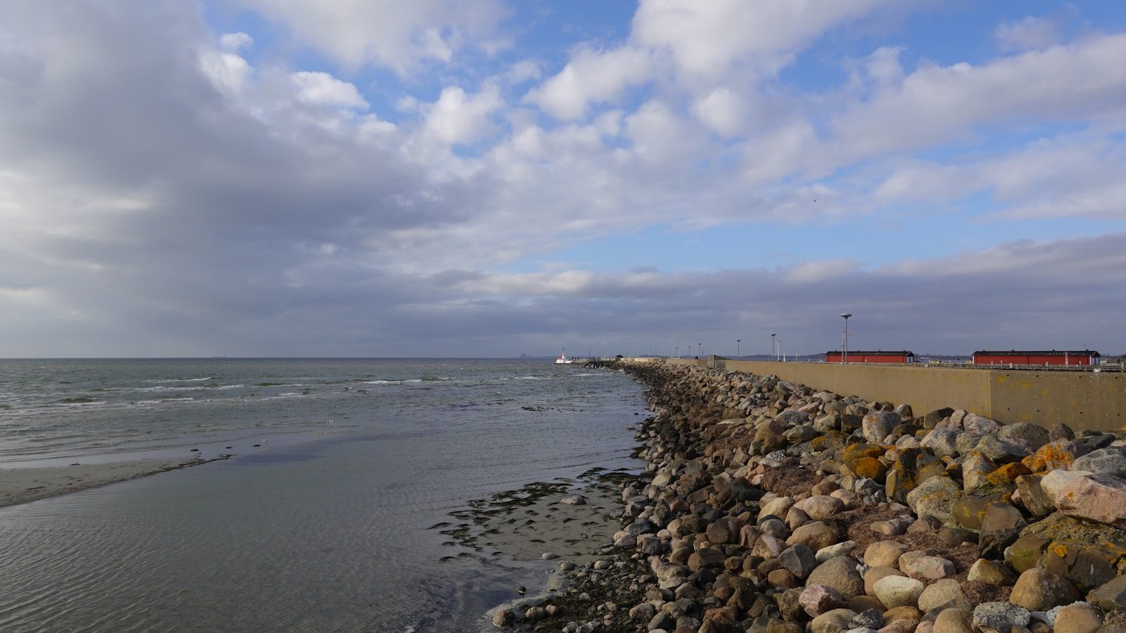 Panoramic view of breakwater·rocky‑shore·boat fishing spots